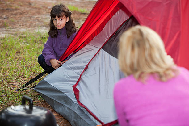 istock Hispanic mother and daughter camping 180699183