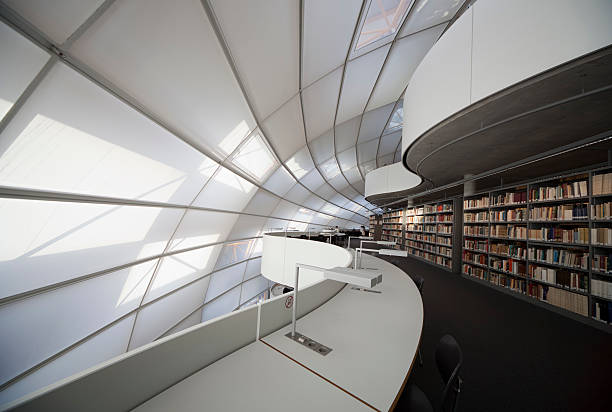 Modern library with books and white light stock photo