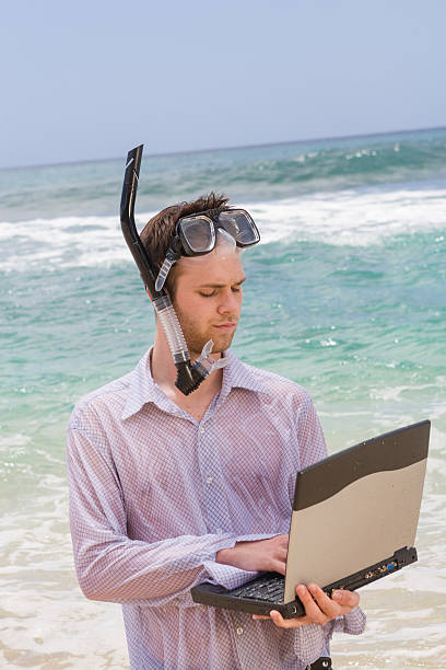 snorkeling nella rete - stranded beached beach businessman foto e immagini stock