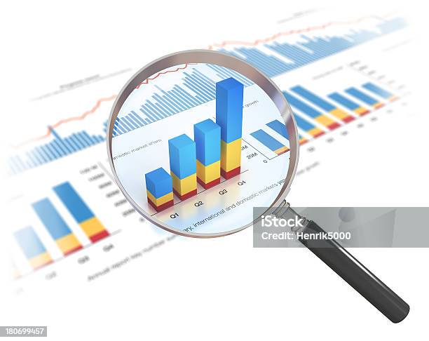 Financial Data And Magnifying Glass Isolated On White Stock Photo - Download Image Now