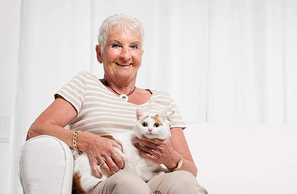 istock Senior woman with cat 180699480
