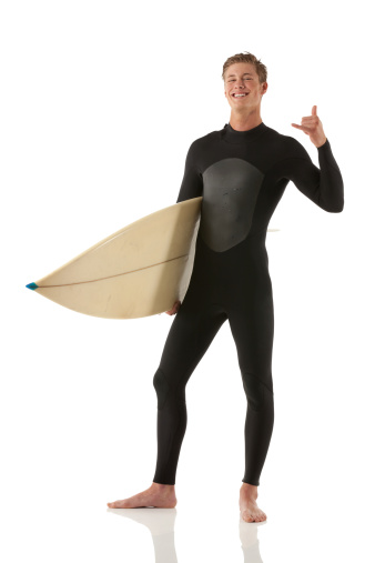 Male surfer standing with a surfboard