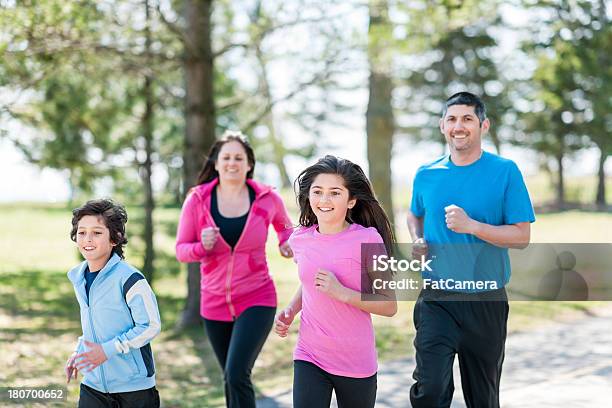 Family Run Stock Photo - Download Image Now - 10-11 Years, 12-13 Years, 30-39 Years