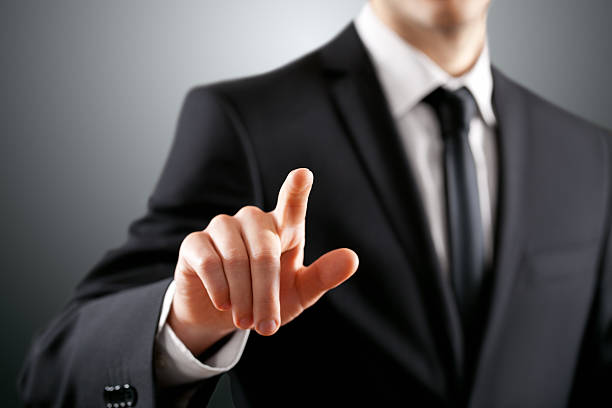 istock A businessman pointing towards the camera 180700654
