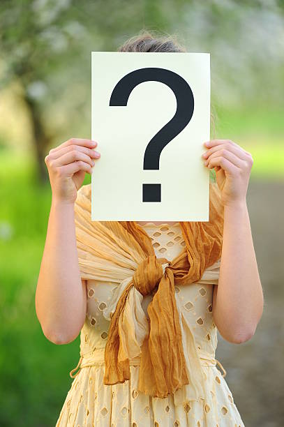 istock Question mark sign in front of face 180700833