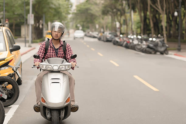 istock Young Asian man drive a motorcycle 180701273