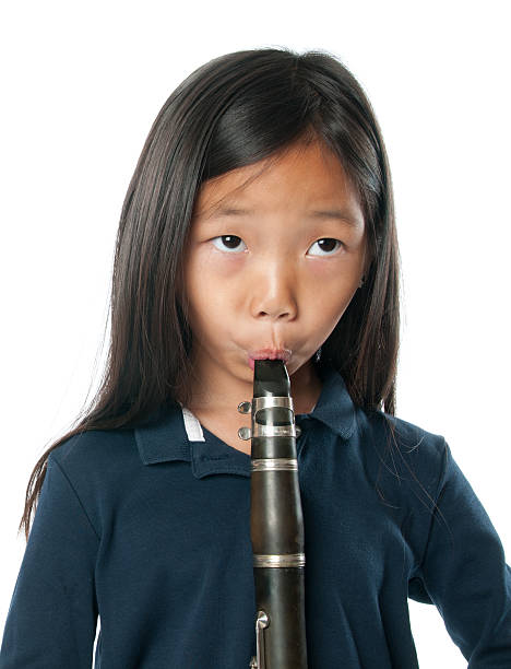 istock Little girl with clarinet 180701428