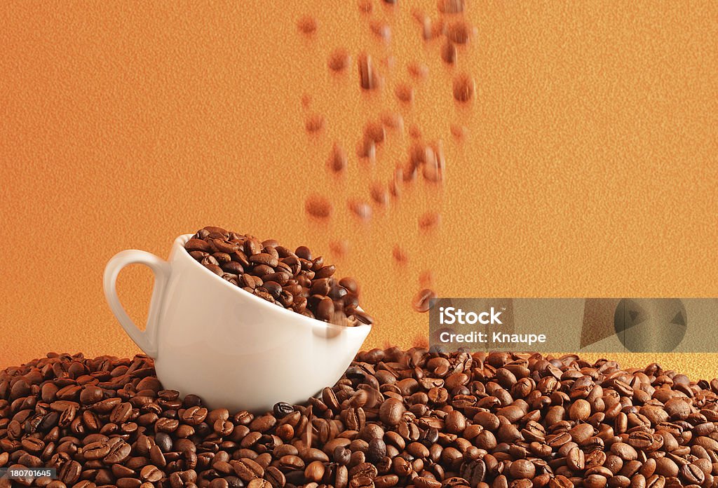 Coffee beans falling into white cup "Coffee beans falling into white cup, beans in motion blur" Blurred Motion Stock Photo