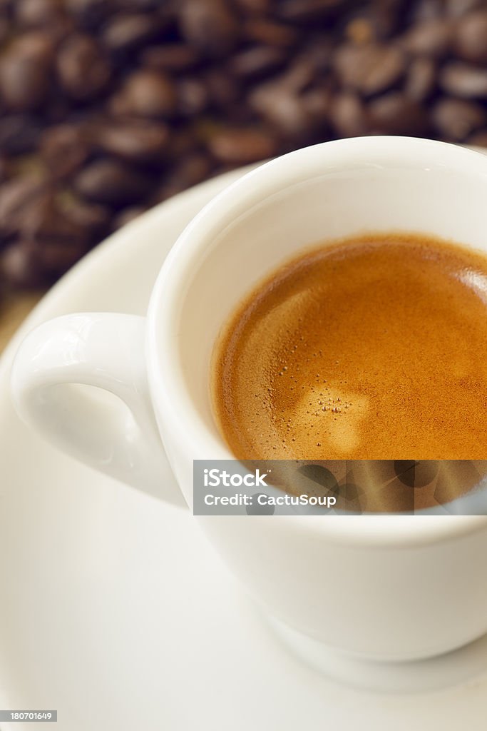 Coffee cup Coffee cup with coffee beans in the background. Abstract Stock Photo