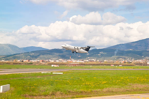 Take Off "Airplane takes off from the runway, slide motion blur on background." florence italy airport stock pictures, royalty-free photos & images