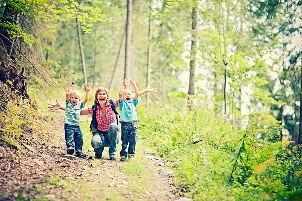 istock Mother and sons hiking 180702787