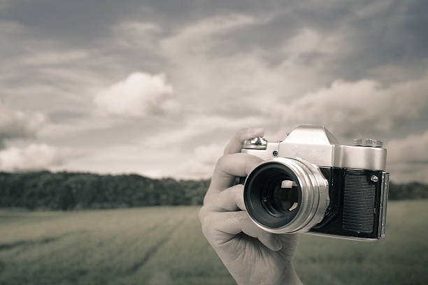 istock Photographing landscape with an old photo camera 180702903