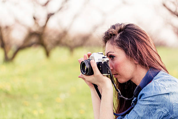 istock Female photographer in a park 180703414