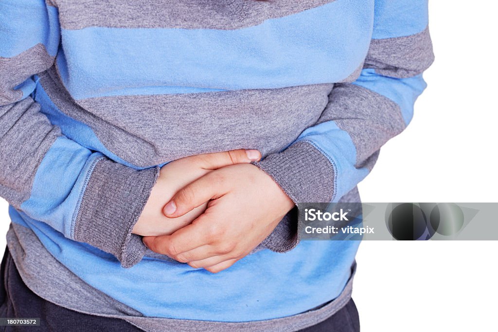 Child with stomach pain Close up of a child hands over stomach Stomachache Stock Photo