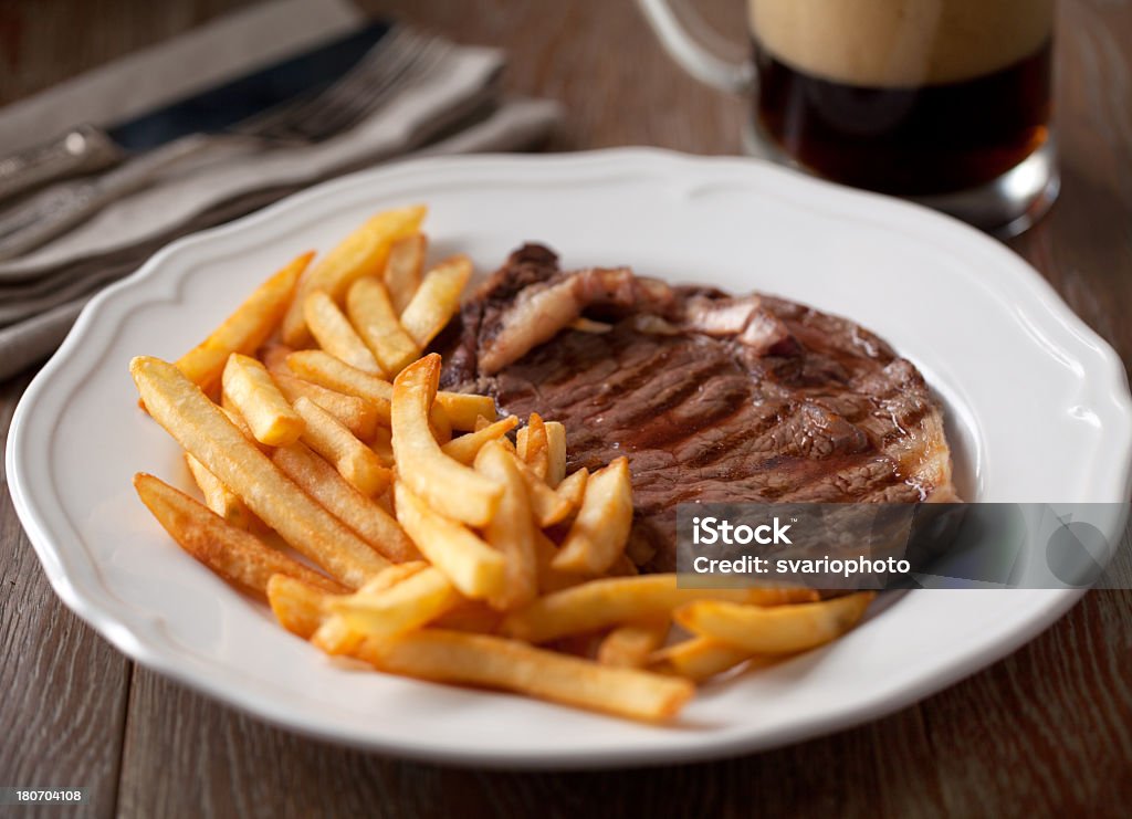 Beef steak with French fries American Culture Stock Photo