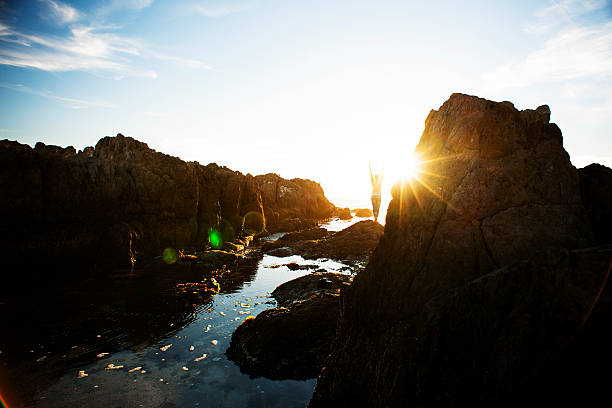 istock Female meditating on the rocks 180705112
