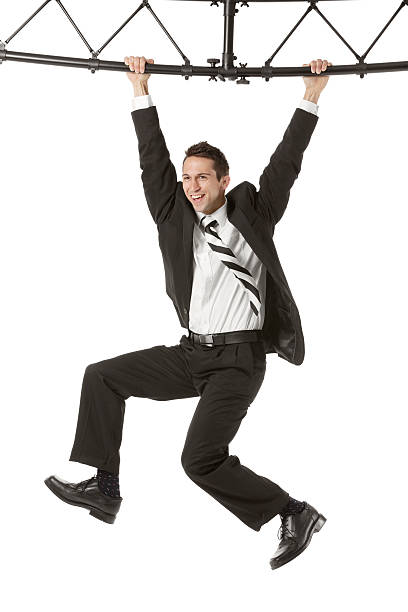 istock Businessman hanging from a metal structure 180705738