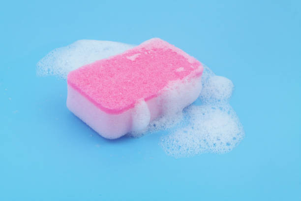 istock Pink sponge with foam on blue background. 1807057814
