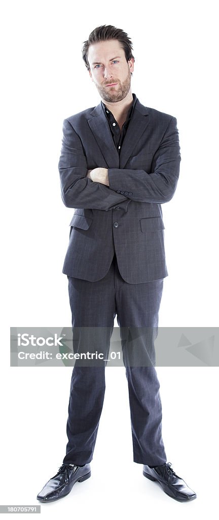 Uomo d'affari che indossa abito grigio su sfondo bianco - Foto stock royalty-free di Abbigliamento elegante