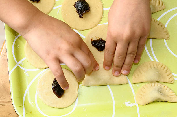 istock Little Girl Making Cookies 180705807