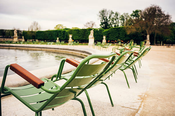 istock Tuileries Garden in Paris with green chairs 180706372