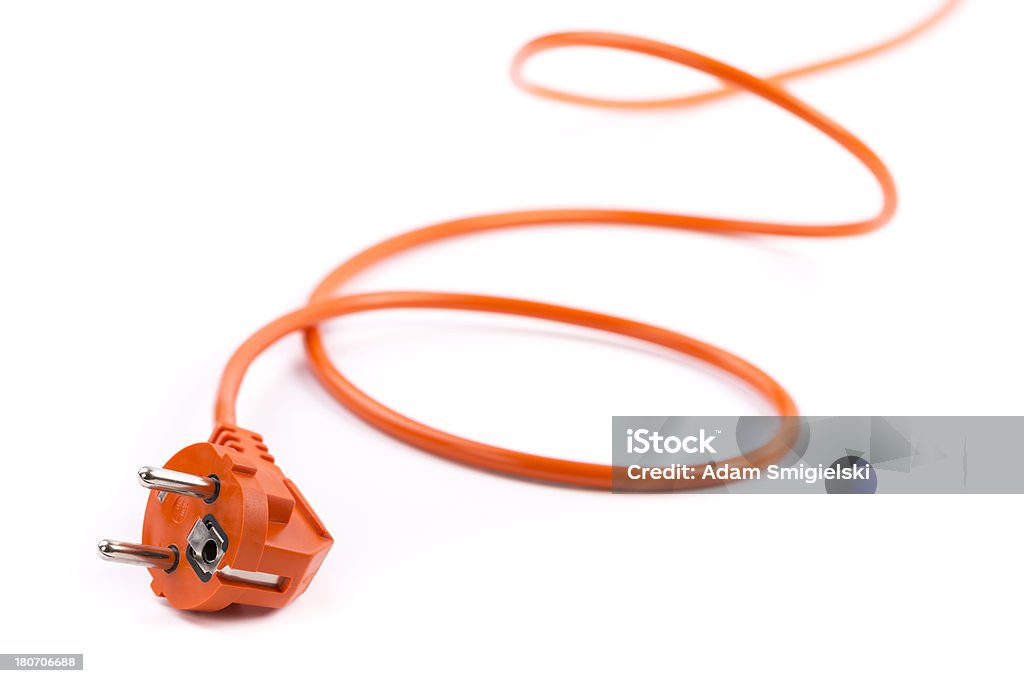 power cable unplugged bright orange electrical cable with plug  on white background Cable Stock Photo