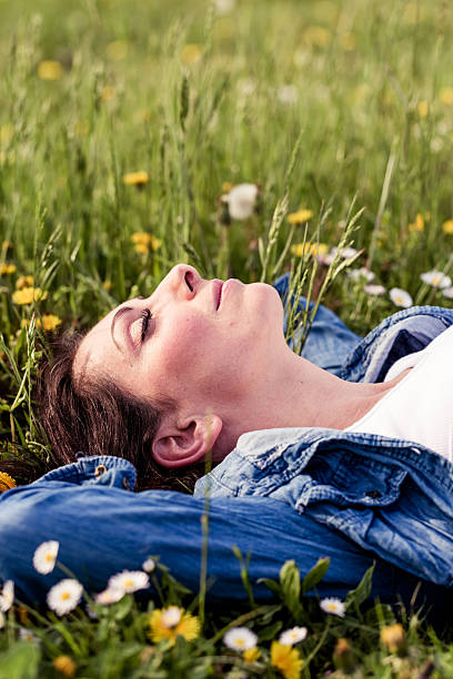 istock Woman lying in a park 180706774