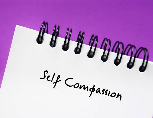 Notebook on copy space purple background with handwritten text  Self Compassion - to focus on self-kindness instead of self-judgement - recognize imperfections and accept yourself anyway Notebook on copy space purple background with handwritten text  Self Compassion - to focus on self-kindness instead of self-judgement - recognize imperfections and accept yourself anyway anyway stock pictures, royalty-free photos & images