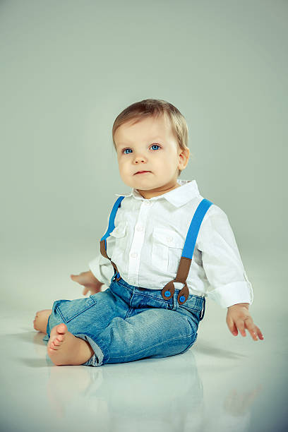 istock Little cute boy sitting on floor 180707325
