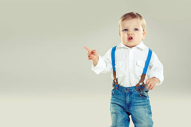 istock Little cute boy pointing with finger 180707484