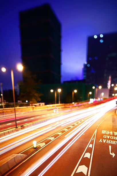 istock City with highway at night, tilt-shift lens effect 180708094