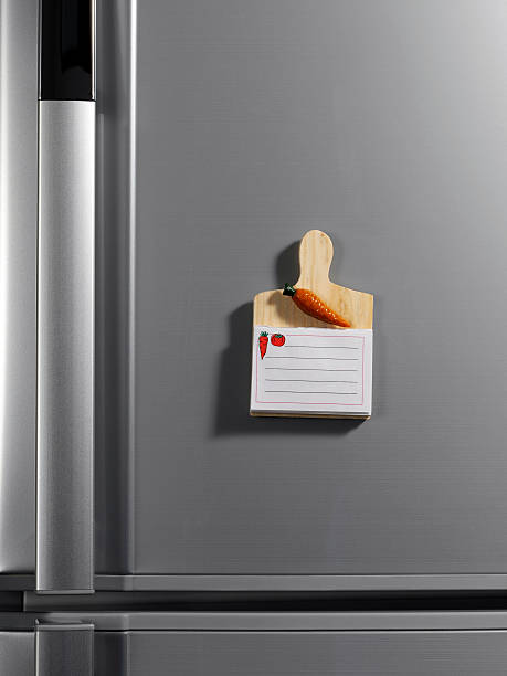 Notepad on the fridge Notepad on the fridge magnet photos stock pictures, royalty-free photos & images