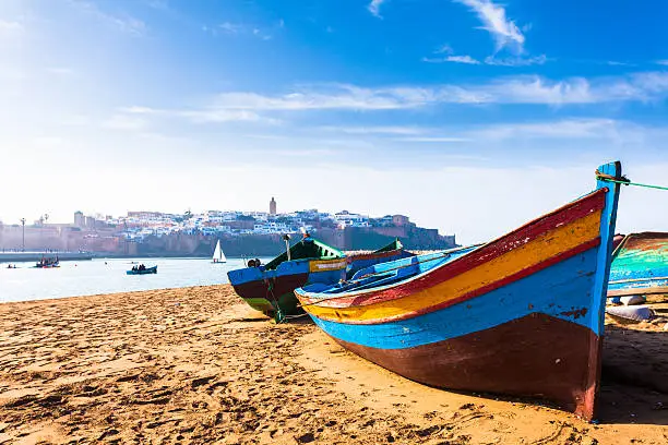 Photo of Colorful Traditional Boats along the Beach in Rabat, Morocco