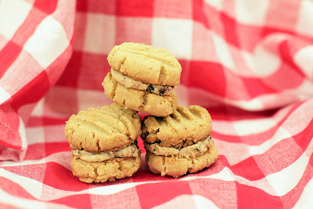 istock Peanut Butter Sandwich Cookies on Checked Tablecloth 180708849