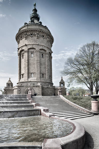 Old water tower in Mannheim, Germany View at an old water tower in Mannheim. Monochrome toned picture. mannheim stock pictures, royalty-free photos & images