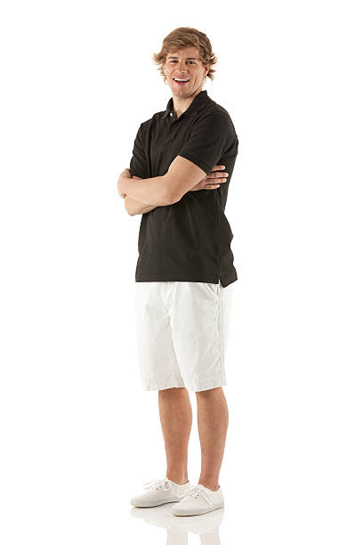 istock Smiling man standing with his arms crossed 180709241