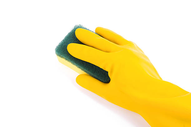 istock Cleaning:yellow glove and sponge isolated on white background 180709435