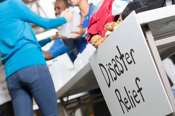 Photo of Closeup of Disaster Relief sign at center handing out water