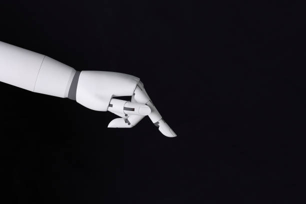 istock Robot hand finger making contact or pressing something on dark isolated background. Cyborg mechanical arm pointing. artificial Intelligence futuristic design concept 1807100819