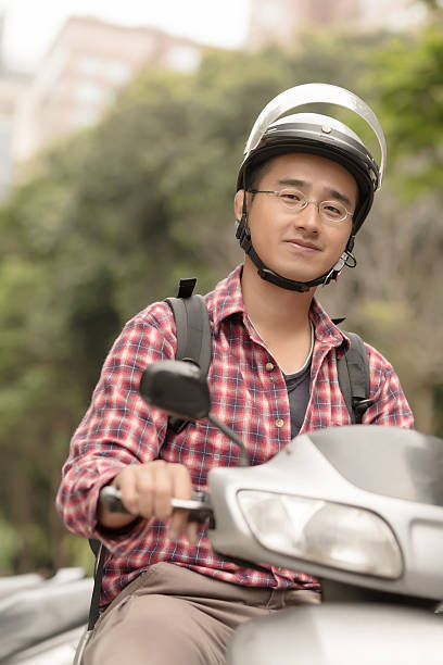 istock Young Asian man drive a motorcycle 180710453
