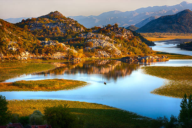 istock Calm lake at sunset 180710738
