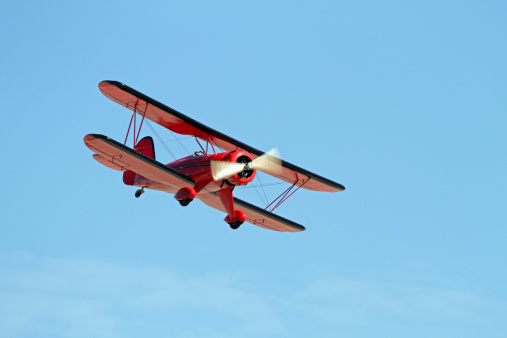 Remote control model bi-plane in flight.