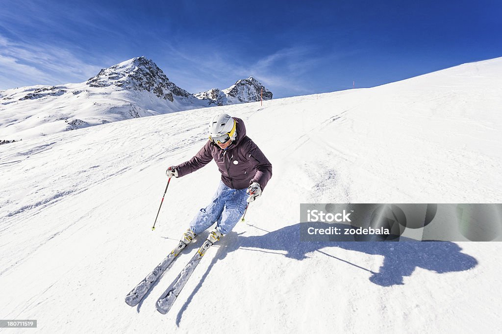 Skier on a Sunny Day Female skier in the alps Skiing Stock Photo