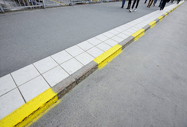 istock Pedestrians on sidewalk,yellow road markings 180711652