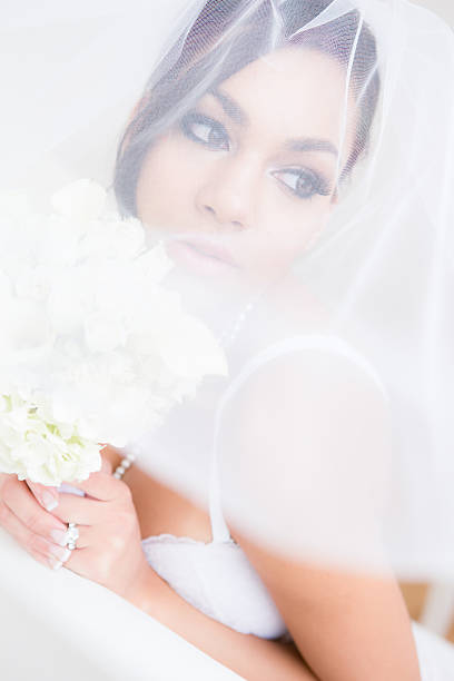 istock Bride in lingerie under veil 180711711