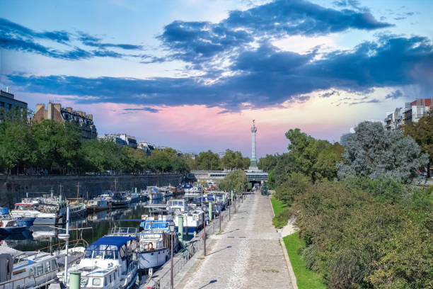 Paris, Bastille, beautiful harbor with houseboats, and the column with the angel