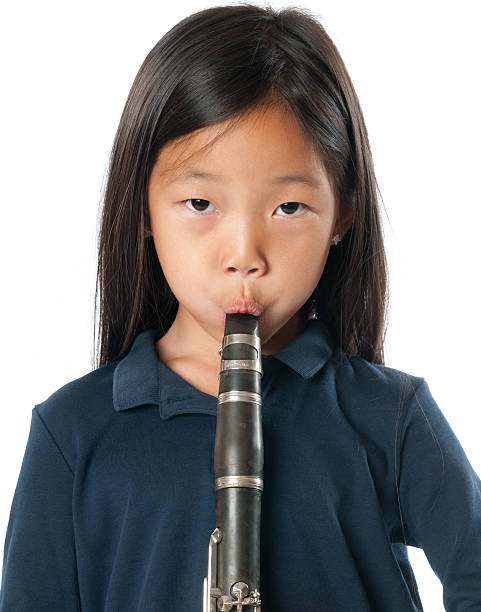 istock Little girl with clarinet 180712366