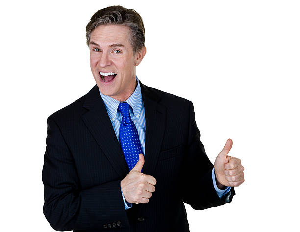 Businessman gesturing thumbs up Kitschy businessman wearing a suit and gesturing thumbs up while being isolated on white background for copy space  cheesy grin photos stock pictures, royalty-free photos & images