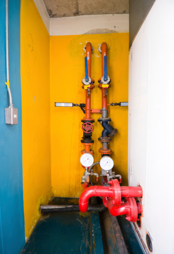 Water pumping station and industrial interior pipes in highrise building office