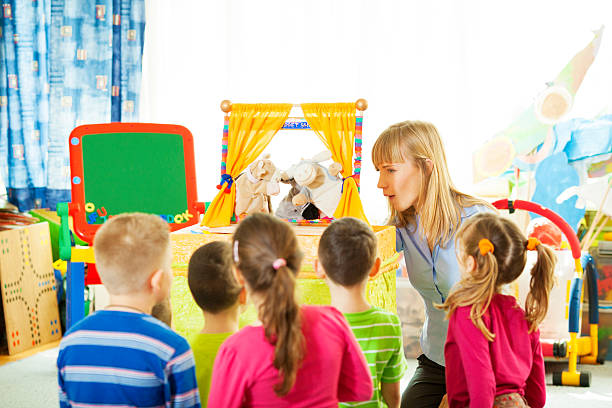 istock Children Playing Finger Puppet Show. 180713297